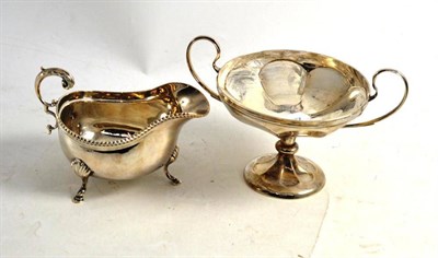 Lot 295 - A silver sauce boat and a silver twin handled pedestal dish