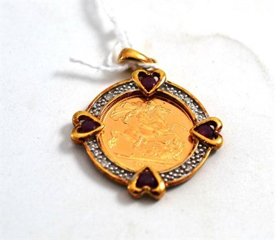 Lot 324 - A 2006 half sovereign in a 9ct gold ruby and diamond set pendant mount