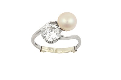 Lot 2113 - A Platinum Pearl and Diamond Twist Ring an old...