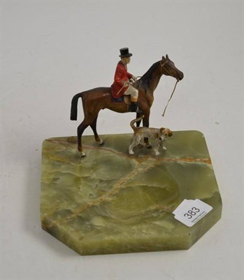 Lot 383 - Cold painted huntsman with hound on onyx dish base