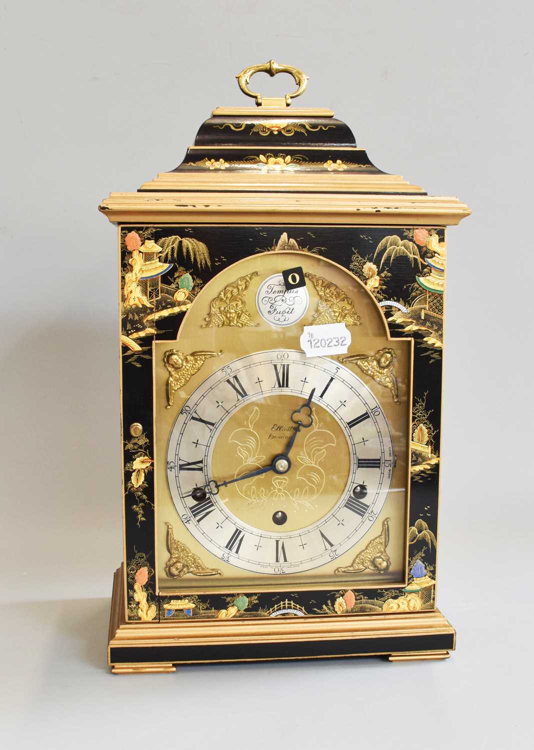 Lot 307 - a Japanned Chiming Table Clock, signed