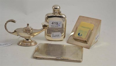 Lot 419 - A silver hip flask, Aladdin's lamp table lighter, desk calendars and a cigarette case