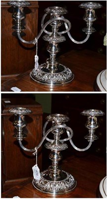 Lot 434 - A pair of silver on copper two branch candelabra