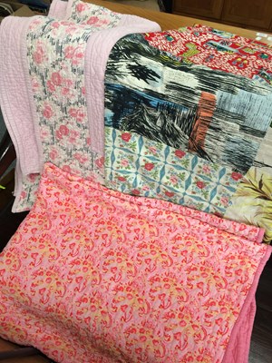 Lot 252 - 20th Century Quilts, comprising a pink floral...