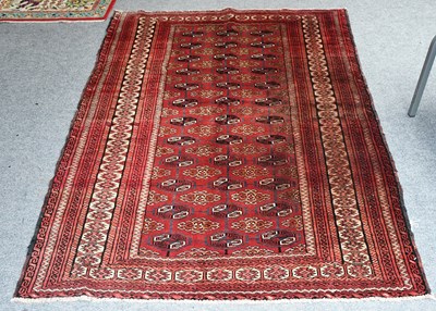 Lot 438 - "Bukhara" Rug, the strawberry field with three...