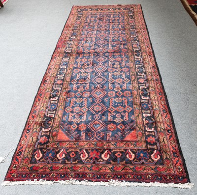 Lot 1234 - Hamadan Runner, the indigo field of hooked...