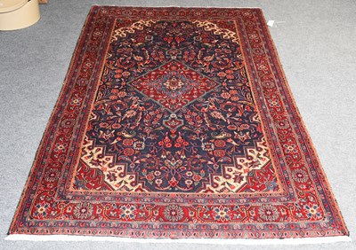 Lot 1232 - Jozan Rug, the indigo field of scrolling vines...