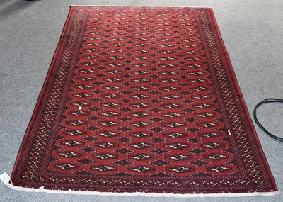 Lot 1230 - "Bukhara" Rug, the blood red field with five...