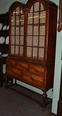 Lot 496 - Walnut glazed cabinet on stand