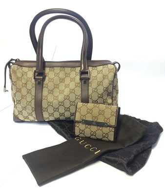 Lot 1076 - A Gucci GG Monogram Woven Logo Bag,...