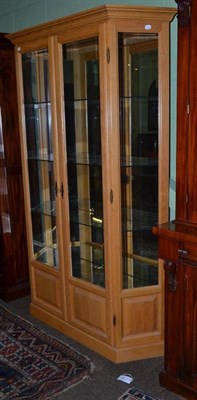 Lot 507 - A modern oak glazed and mirrored display cabinet