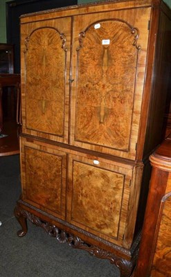 Lot 523 - 20th century walnut cocktail cabinet