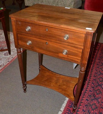 Lot 552 - Late Regency mahogany work/side table on reeded legs