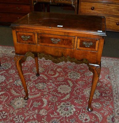 Lot 554 - A walnut low boy