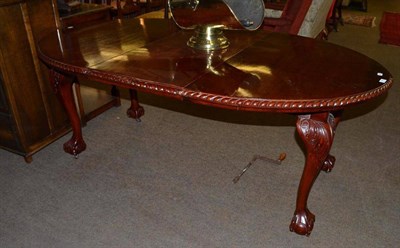 Lot 555 - A mahogany extending dining table