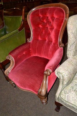 Lot 566 - A Victorian mahogany framed button back upholstered elbow chair