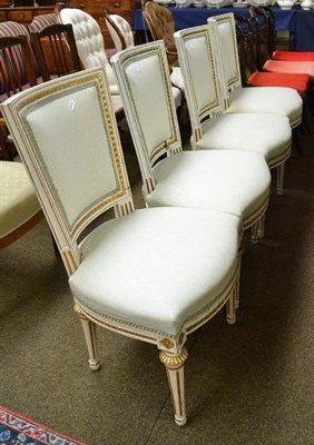 Lot 573 - A set of four white painted chairs