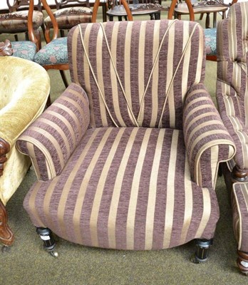 Lot 579 - A late 19th century ebonised nursing chair stamped 'Gillow'