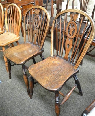 Lot 586 - Two rustic country kitchen chairs with fleur-de-lys motif