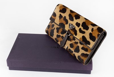 Lot 1062 - A Prada Leopard Print Wallet, with brown...