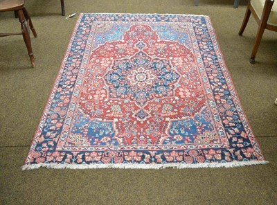 Lot 592 - Khoi rug, Persian Azerbaijan, the field with flowering vines around an indigo medallion framed...