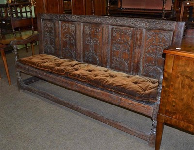 Lot 602 - 18th century carved oak settle