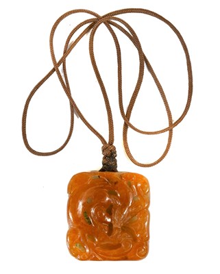 Lot 196 - A Chinese Celadon and Russet Jade Pendant, of...