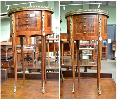 Lot 604 - A pair of oval bedside tables with gilt mounts