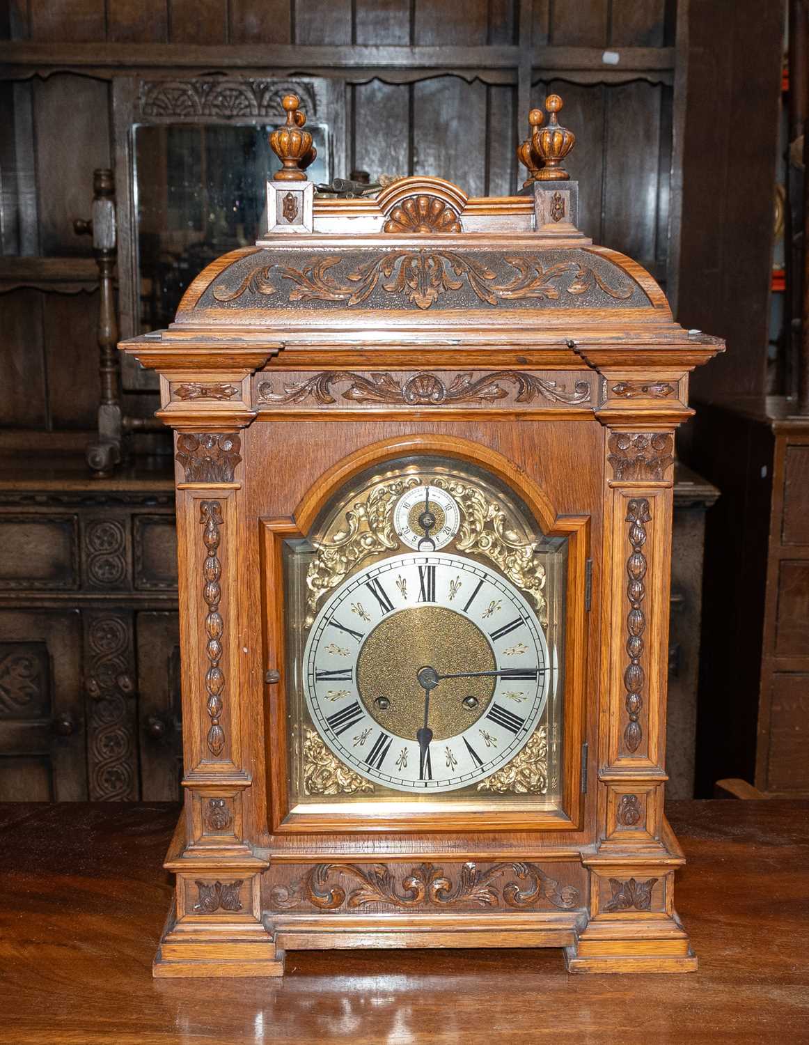 Lot 1356 - An Oak Cased Quarter Striking Table Clock,...