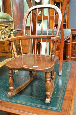 Lot 615 - A child's ash and elm Windsor rocking chair