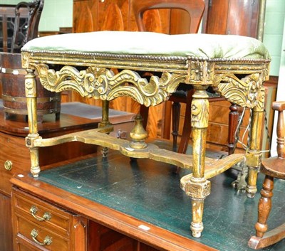 Lot 616 - A gilt framed dressing stool