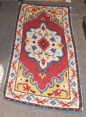 Lot 1251 - Anatolian Rug, the brick red field centred by...