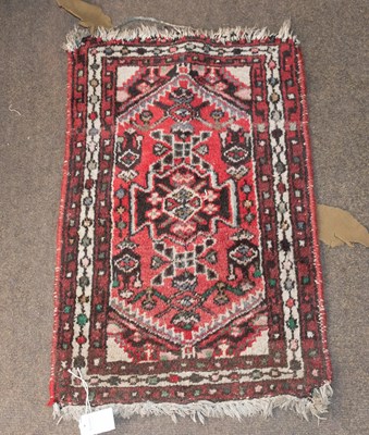 Lot 1251 - Anatolian Rug, the brick red field centred by...