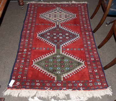 Lot 1251 - Anatolian Rug, the brick red field centred by...