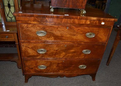 Lot 632 - A late Georgian mahogany three height chest of drawers