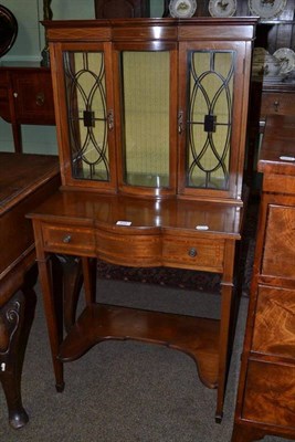 Lot 634 - An Edwardian inlaid mahogany glazed display cabinet on single drawer base