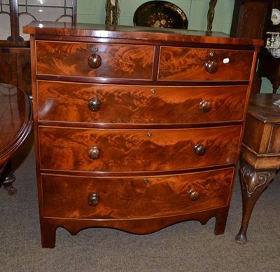 Lot 637 - A 19th century mahogany bow fronted four height chest of drawers with rosewood handles