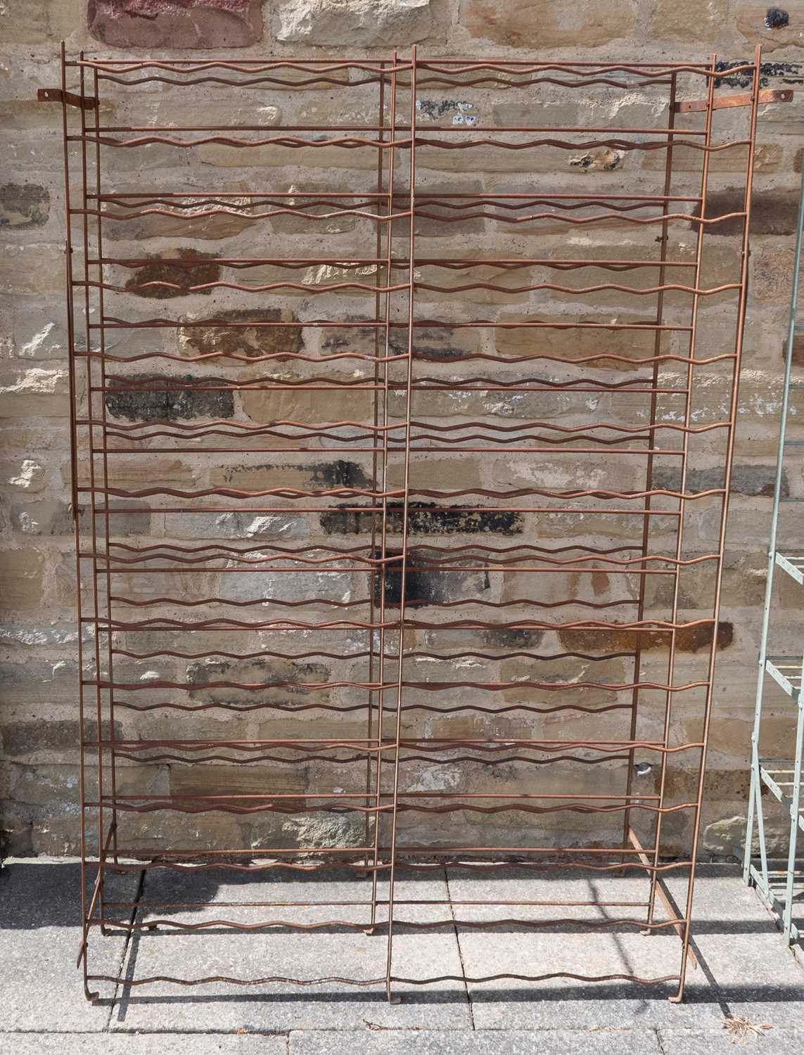 Lot 1119 - A Weathered Painted Metal Wine Rack, 102cm by...