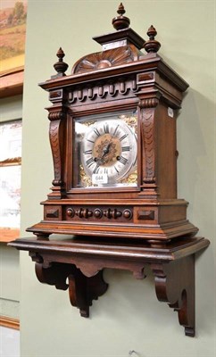 Lot 644 - A quarter striking mantel clock with wall bracket