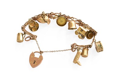 Lot 222 - A Fancy Link Bracelet, suspending eleven...