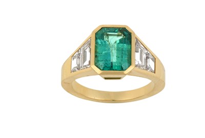 Lot 2014 - An Emerald and Diamond Ring the emerald-cut...