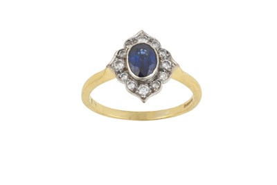 Lot 2377 - An 18 Carat Gold Sapphire and Diamond Cluster...