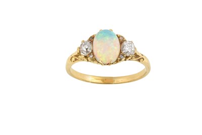 Lot 2469 - An Opal and Diamond Three Stone Ring the oval...