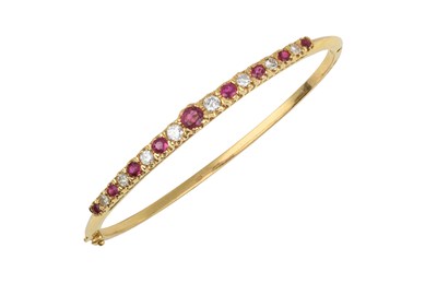 Lot 2039 - A Ruby and Diamond Hinged Bangle graduated...