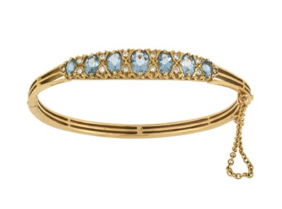 Lot 2332 - A 9 Carat Gold Aquamarine and Diamond Bangle...