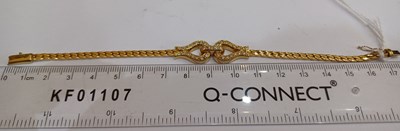 Lot 2003 - An 18 Carat Gold Diamond Necklace and Bracelet...