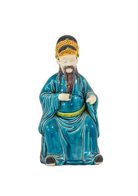 Lot 105 - A Chinese Fahua Porcelain Figure of a...
