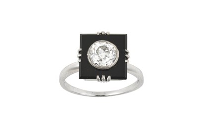 Lot 2108 - An Onyx and Diamond Ring the square onyx...