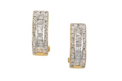 Lot 2307 - A Pair of Diamond Earrings a row of baguette...