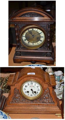 Lot 18 - A carved oak mantel clock striking a single bell and another striking a gong